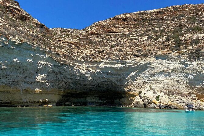 5 hour boat trip to Lampedusa with Sandwich, SUP and Snorkeling - The Early Views: Marine Reserve Edges and a Migration Monument