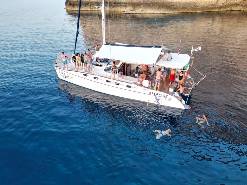 Lampedusa: Dolphin watching with aperitif at sunset - The moonlight cove stop: when the sea becomes the setting