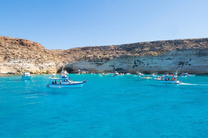 SciatumiaDay boat tour to Lampedusa with typical lunch - Stop 1: Isola dei Conigli for a calm, special kind of coastline